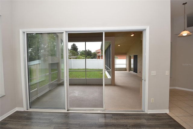 entryway with dark hardwood / wood-style floors