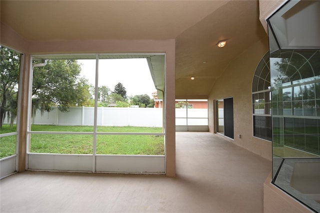 unfurnished sunroom featuring a wealth of natural light