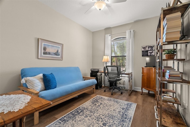 sitting room featuring ceiling fan and dark hardwood / wood-style floors