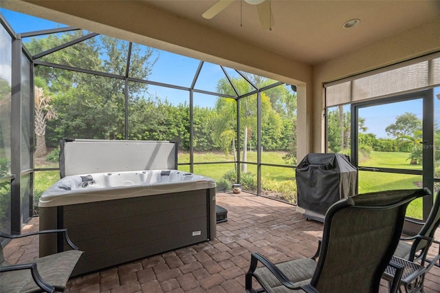 sunroom with a jacuzzi