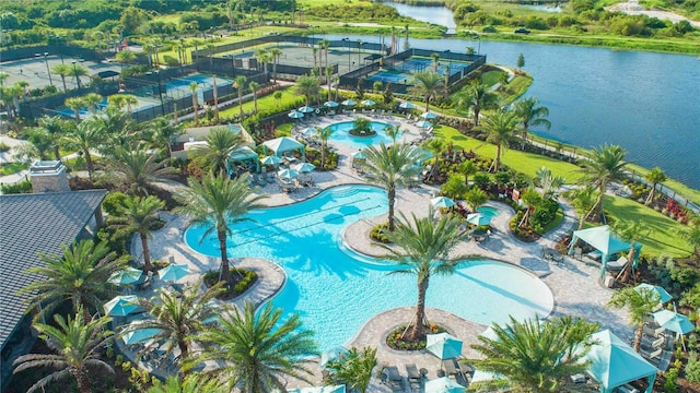 birds eye view of property with a water view