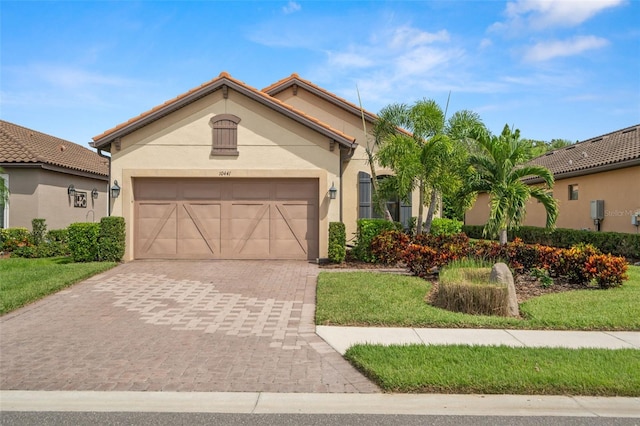 mediterranean / spanish house with a garage