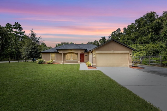 view of front of house with a lawn and a garage