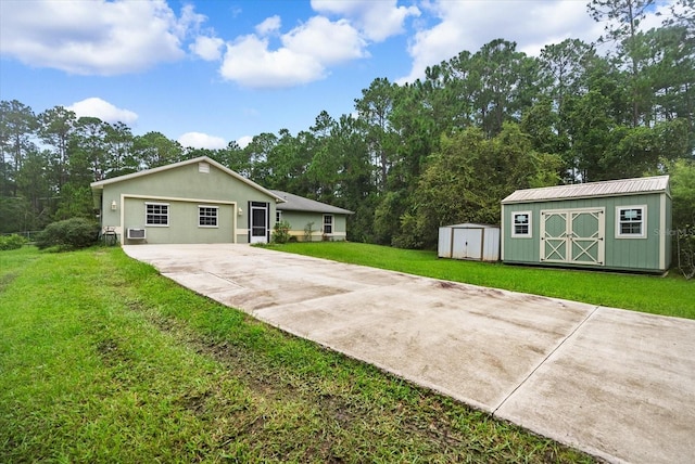 exterior space featuring a front yard and a shed