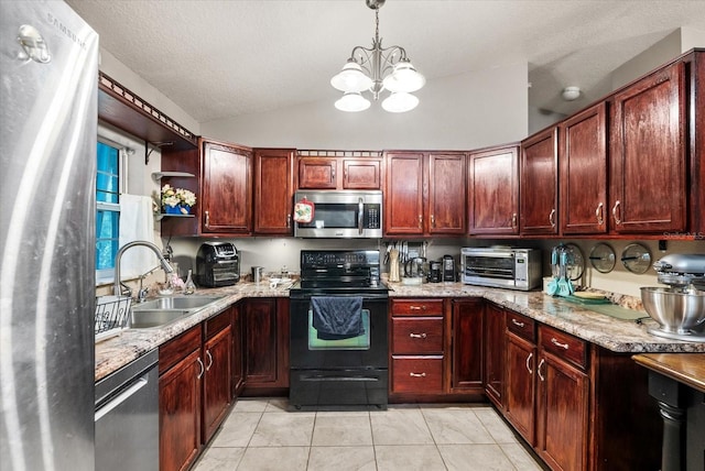 kitchen featuring an inviting chandelier, appliances with stainless steel finishes, sink, decorative light fixtures, and light tile patterned flooring