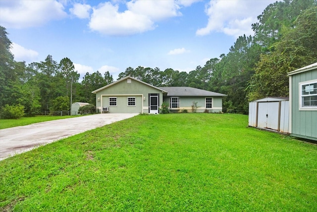 single story home with a storage unit and a front lawn