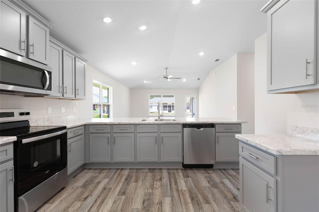 17 Service Berry Pl, Palm Coast, FL 32164 - kitchen with appliances with stainless steel finishes, gray cabinets, light wood-style floors, ceiling fan, and recessed lighting