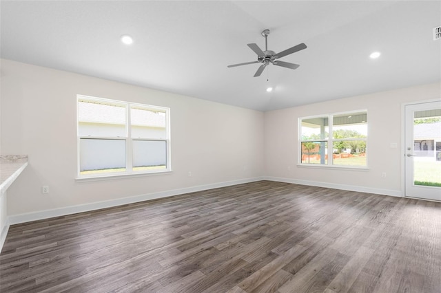 17 Service Berry Pl, Palm Coast, FL 32164 - empty room featuring dark wood-style flooring, ceiling fan, vaulted ceiling, and recessed lighting