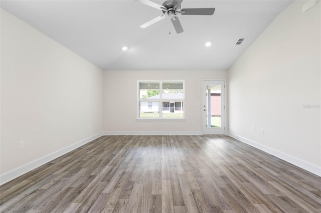17 Service Berry Pl, Palm Coast, FL 32164 - spare room featuring lofted ceiling, wood finished floors, a ceiling fan, and recessed lighting