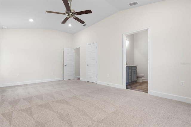 17 Service Berry Pl, Palm Coast, FL 32164 - unfurnished bedroom with vaulted ceiling, light carpet, connected bathroom, and recessed lighting