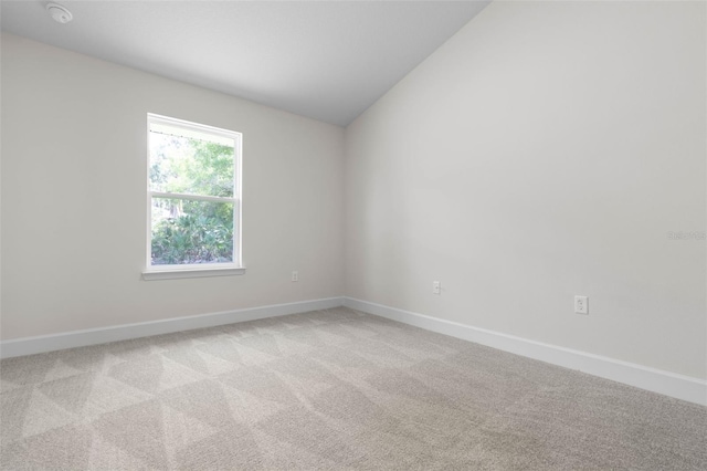 17 Service Berry Pl, Palm Coast, FL 32164 - unfurnished room featuring carpet, a smoke detector, and lofted ceiling