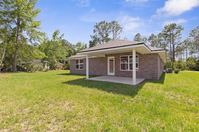 17 Service Berry Pl, Palm Coast, FL 32164 - back of property featuring a patio area, a yard, and brick siding