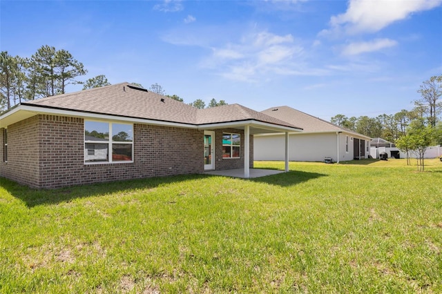 17 Service Berry Pl, Palm Coast, FL 32164 - back of house featuring a patio area, brick siding, and a yard