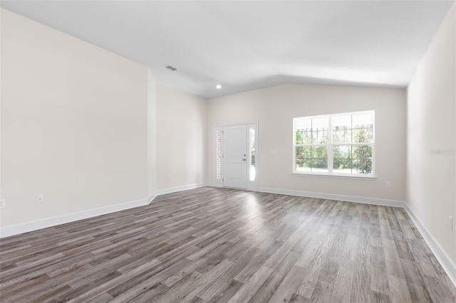 17 Service Berry Pl, Palm Coast, FL 32164 - unfurnished living room featuring wood finished floors and lofted ceiling