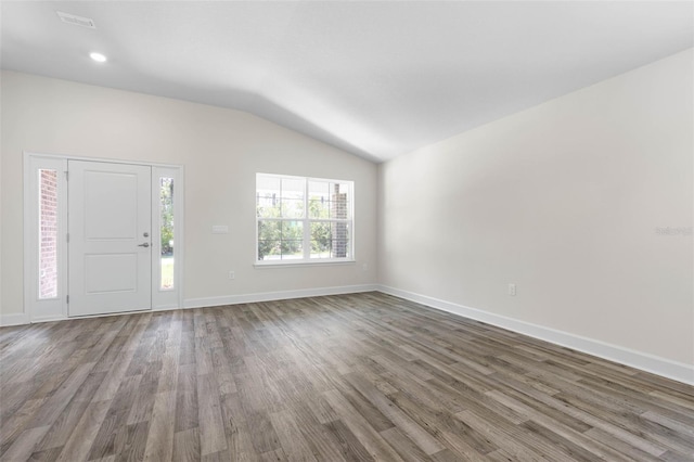 17 Service Berry Pl, Palm Coast, FL 32164 - foyer entrance with vaulted ceiling, wood finished floors, and recessed lighting