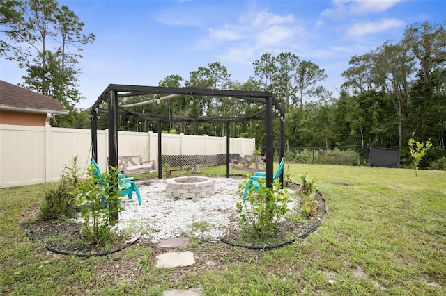 view of yard featuring an outdoor fire pit