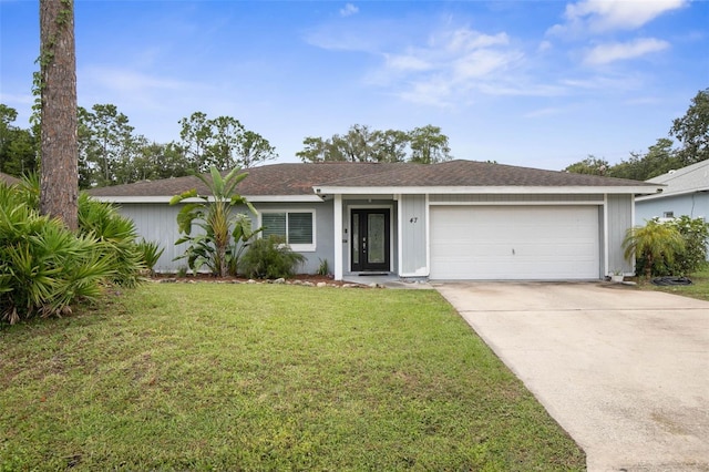 ranch-style house with a garage and a front lawn