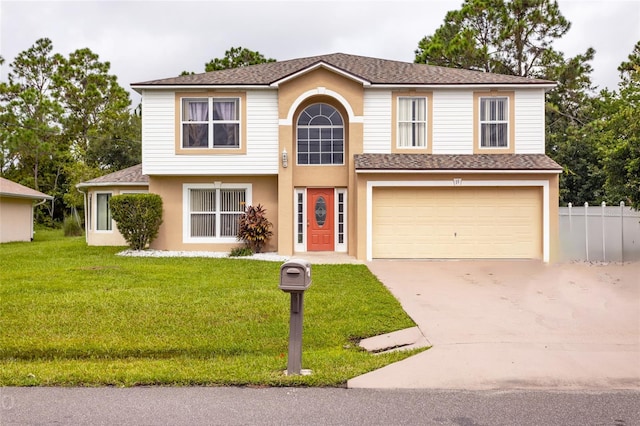 view of front of property featuring a front yard and a garage