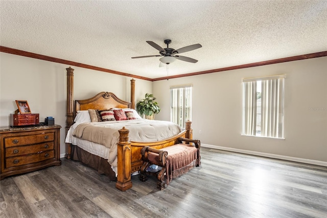 bedroom with wood-type flooring, a textured ceiling, ceiling fan, and crown molding