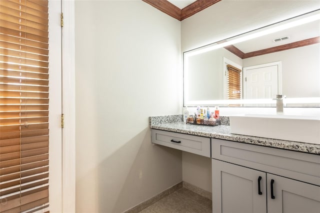 bathroom featuring vanity, tile patterned floors, and crown molding