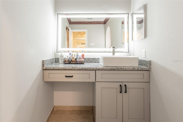 bathroom with tile patterned floors and vanity