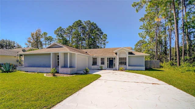 single story home with a front yard, fence, stucco siding, concrete driveway, and a garage