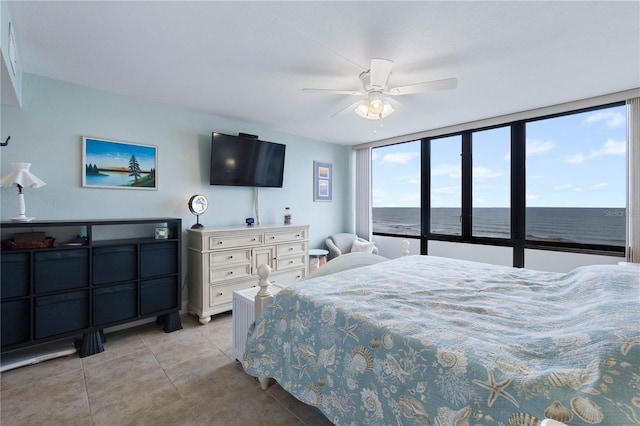 bedroom featuring light tile patterned flooring and ceiling fan