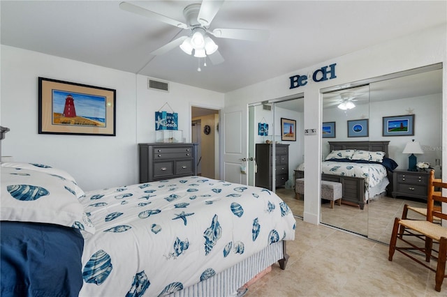 bedroom featuring two closets and ceiling fan