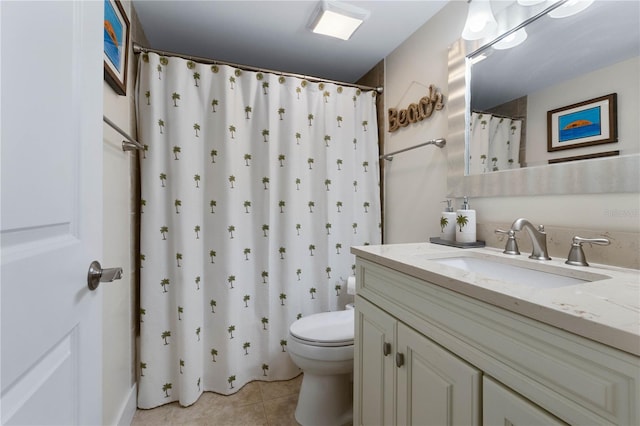 bathroom with vanity, toilet, a shower with shower curtain, and tile patterned floors