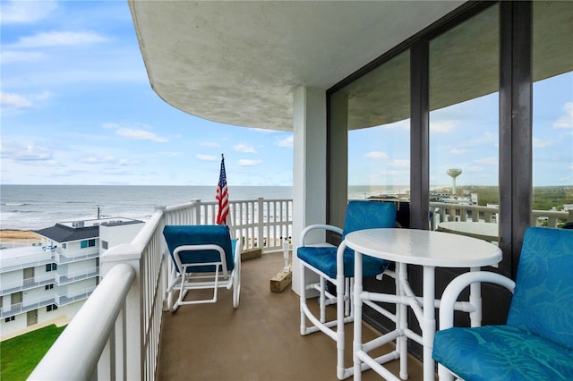 balcony featuring a water view