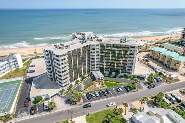 birds eye view of property with a view of the beach and a water view