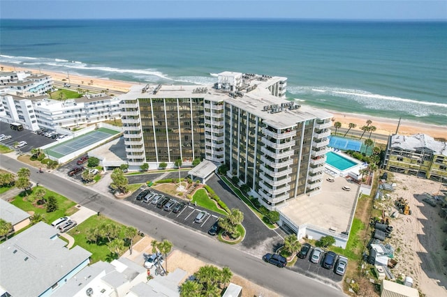 bird's eye view with a beach view and a water view