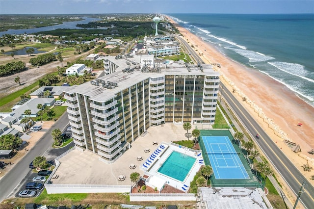 bird's eye view featuring a water view and a view of the beach