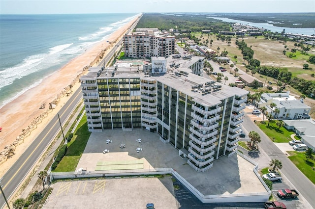 aerial view featuring a water view and a view of the beach