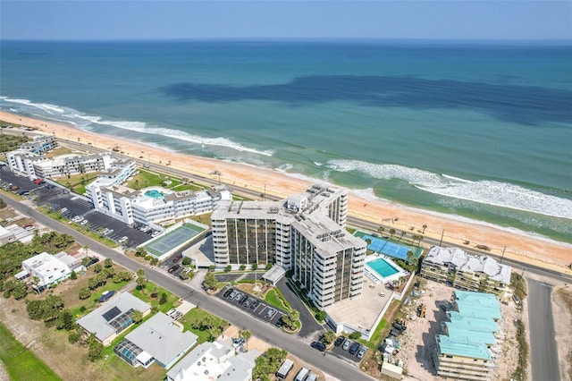 drone / aerial view featuring a view of the beach and a water view