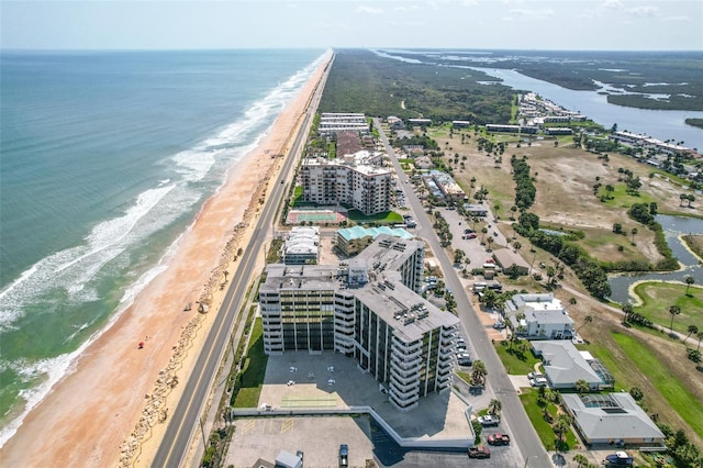 drone / aerial view with a view of the beach and a water view