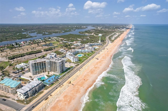 aerial view featuring a view of the beach and a water view