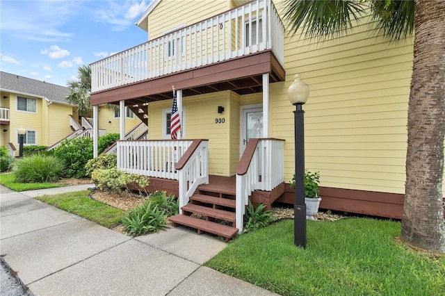 entrance to property with a yard