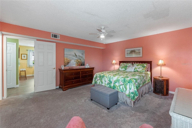 bedroom with a textured ceiling, ceiling fan, and carpet floors