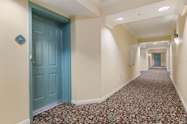 hall featuring carpet floors and crown molding