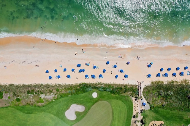 drone / aerial view featuring a water view and a beach view