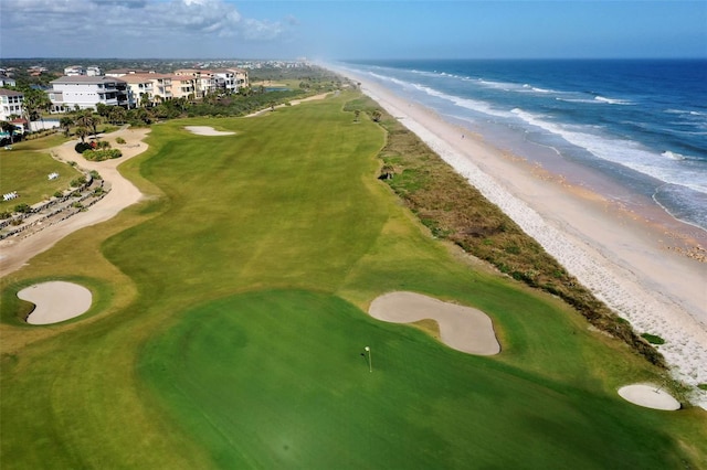 bird's eye view with a beach view and a water view