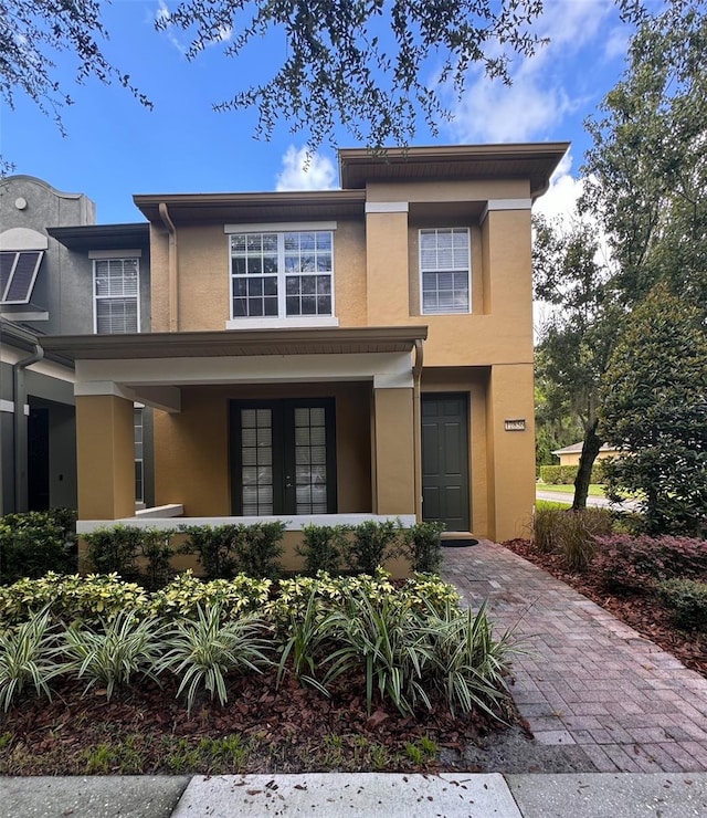 view of front of house featuring a garage and covered porch