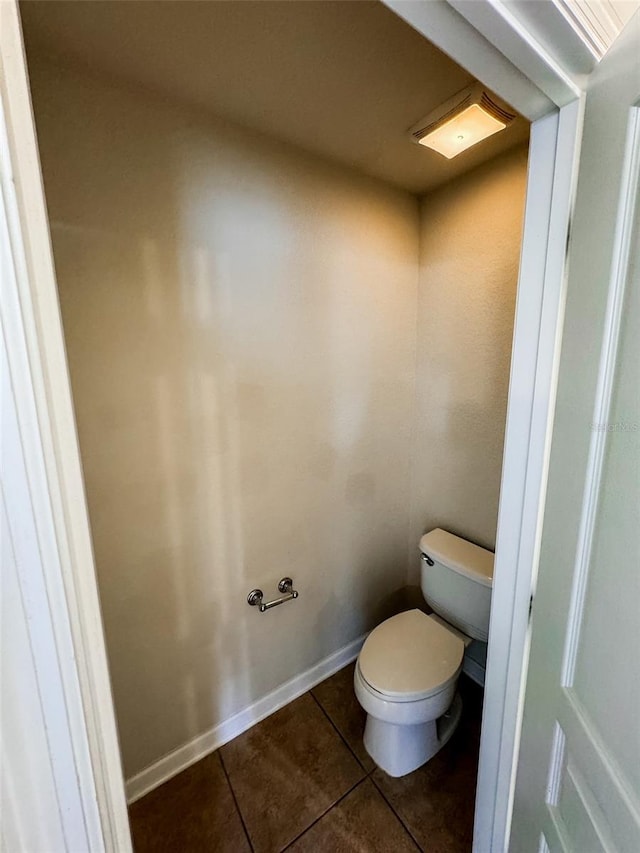 bathroom with tile patterned flooring and toilet