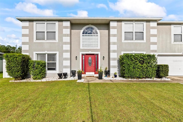 view of front of house featuring a front yard and a garage