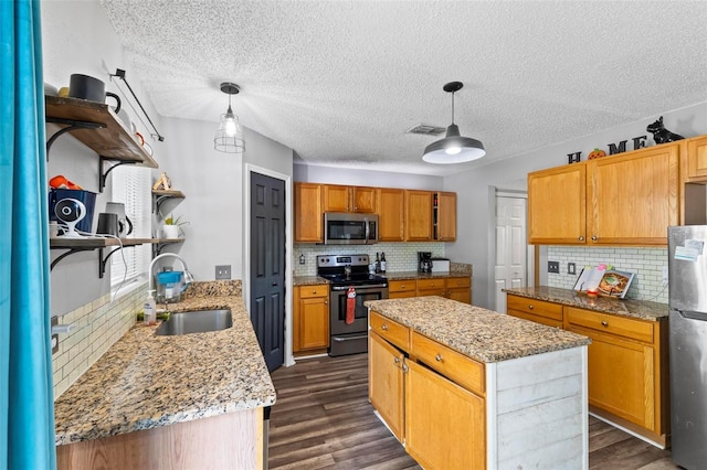 kitchen featuring a center island, hanging light fixtures, stainless steel appliances, backsplash, and dark hardwood / wood-style flooring