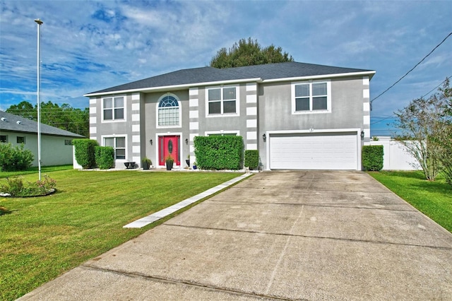 view of front facade featuring a front yard and a garage