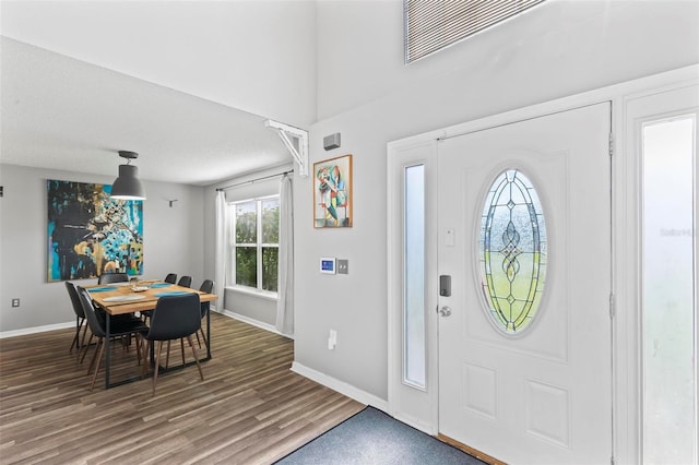 entryway featuring a textured ceiling and hardwood / wood-style floors