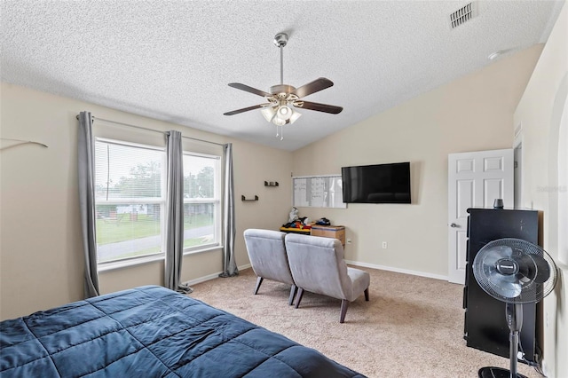 carpeted bedroom featuring ceiling fan, a textured ceiling, and vaulted ceiling