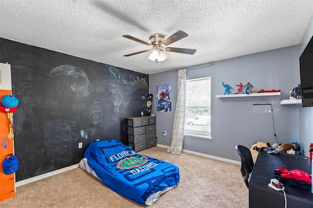 bedroom featuring a textured ceiling, carpet, and ceiling fan